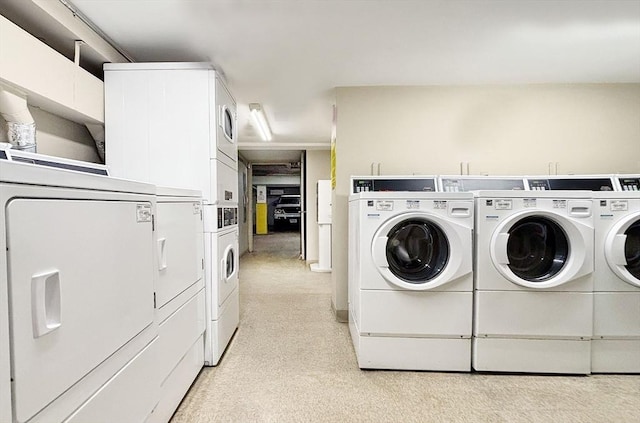 585 Revere Beach Pkwy Unit 410, Revere, MA 02151 - community laundry featuring estacked washer and dryer, washing machine and dryer, and light colored carpet