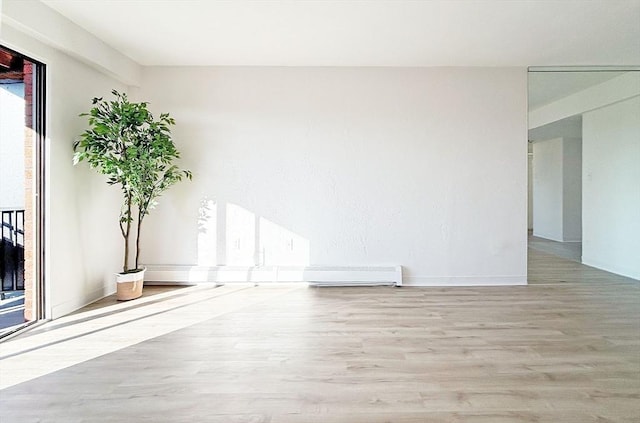 585 Revere Beach Pkwy Unit 410, Revere, MA 02151 - spare room with wood finished floors, plenty of natural light, and baseboards
