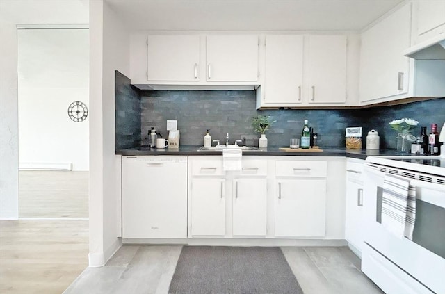 585 Revere Beach Pkwy Unit 410, Revere, MA 02151 - kitchen featuring white appliances, decorative backsplash, white cabinets, and dark countertops