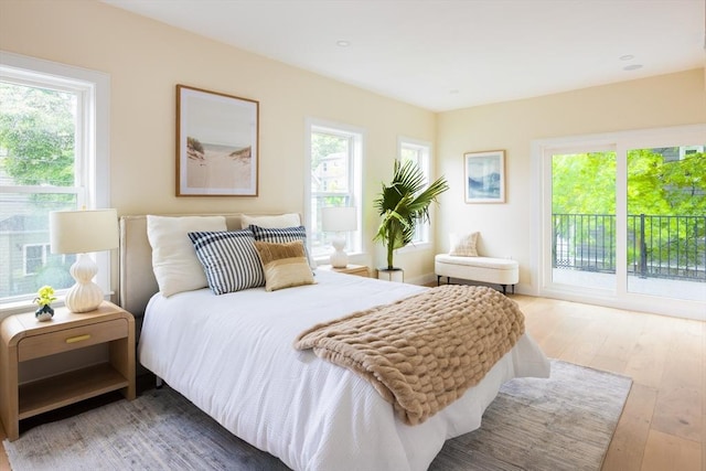 24 Ivory St, Boston, MA 02132 - bedroom with access to outside and hardwood / wood-style floors