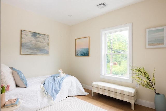24 Ivory St, Boston, MA 02132 - bedroom featuring baseboards and wood finished floors