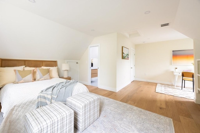 24 Ivory St, Boston, MA 02132 - bedroom with attic access, light wood-type flooring, baseboards, vaulted ceiling, and ensuite bath