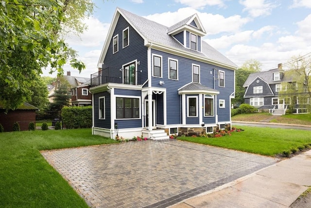 24 Ivory St, Boston, MA 02132 - american foursquare style home featuring a balcony and a front yard