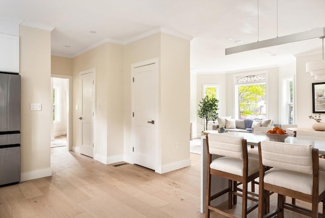 24 Ivory St, Boston, MA 02132 - dining space featuring light wood-style floors, baseboards, ornamental molding, and recessed lighting