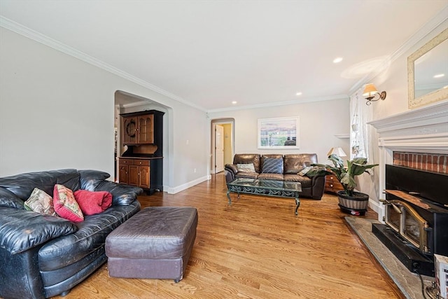 57 Century Rd, Weymouth, MA 02190 - living room with arched walkways, light wood-type flooring, crown molding, recessed lighting, and baseboards