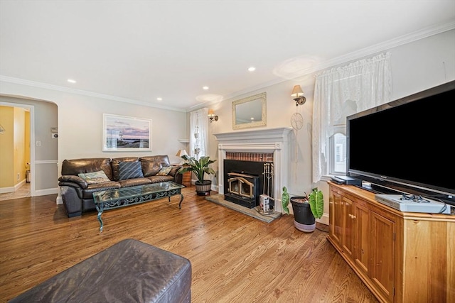 57 Century Rd, Weymouth, MA 02190 - living room featuring ornamental molding, baseboards, a brick fireplace, light wood finished floors, and recessed lighting