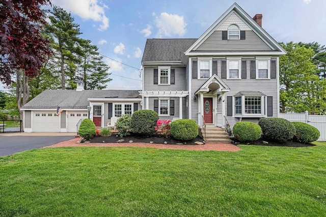 57 Century Rd, Weymouth, MA 02190 - view of front of house with driveway, a chimney, a garage, and roof with shingles