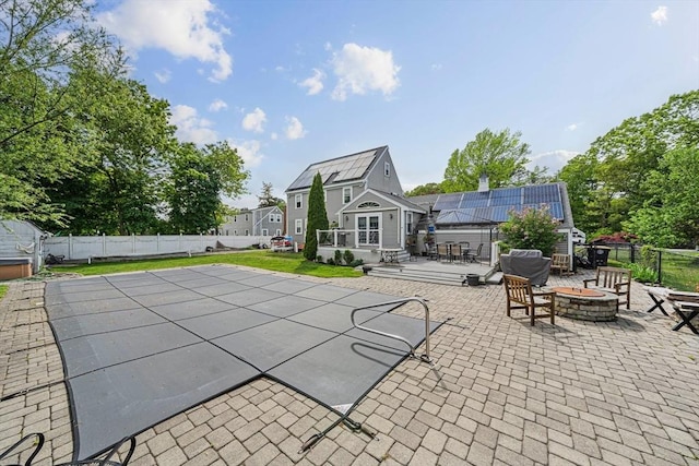 57 Century Rd, Weymouth, MA 02190 - view of pool featuring an outdoor fire pit, a patio area, a fenced backyard, and an outbuilding