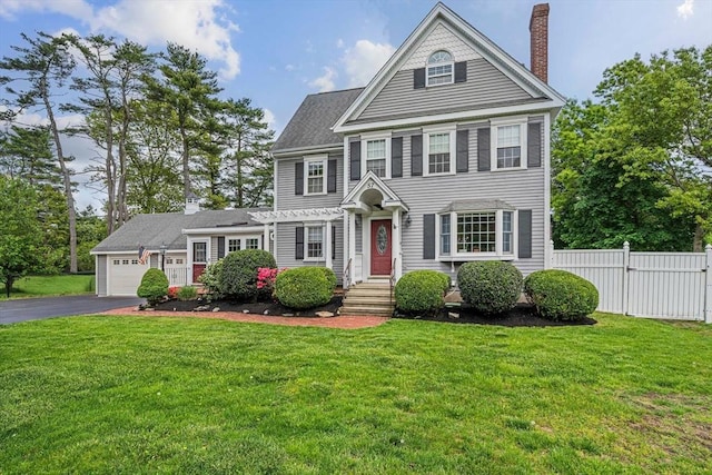 57 Century Rd, Weymouth, MA 02190 - view of front facade with driveway, a chimney, a garage, and a pergola