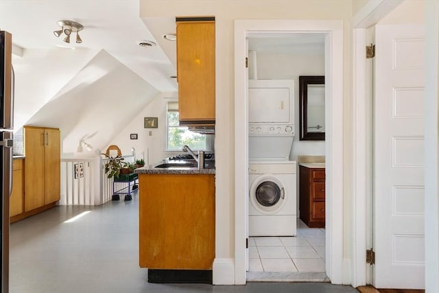 112 School Unit 3, Boston, MA 02119 - laundry room with stacked washing machine and dryer