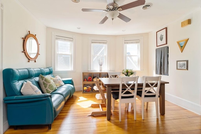 112 School Unit 3, Boston, MA 02119 - dining area featuring light wood finished floors, ceiling fan, baseboards, and ornamental molding