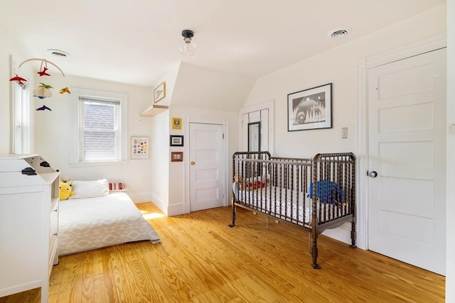112 School Unit 3, Boston, MA 02119 - bedroom with light wood-type flooring and baseboards