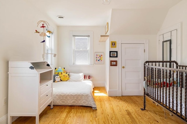 112 School Unit 3, Boston, MA 02119 - bedroom with light wood-style flooring and baseboards