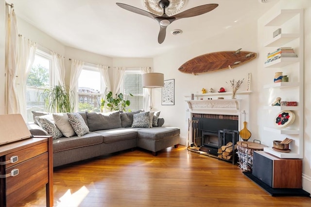 112 School Unit 3, Boston, MA 02119 - living room featuring hardwood / wood-style flooring, ceiling fan, and a fireplace