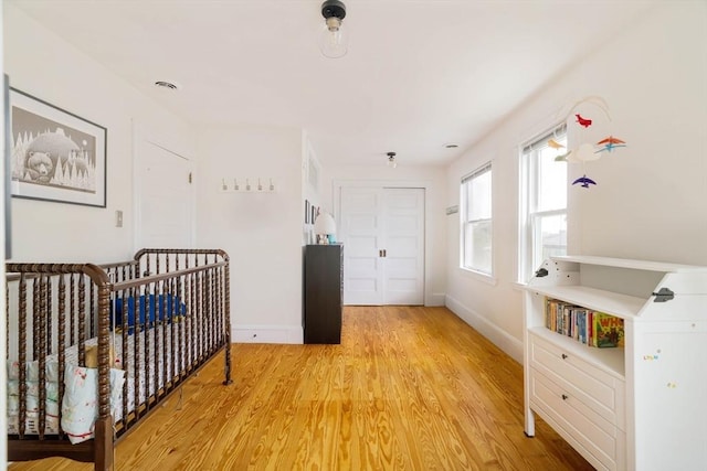 112 School Unit 3, Boston, MA 02119 - bedroom featuring light wood-style flooring and baseboards