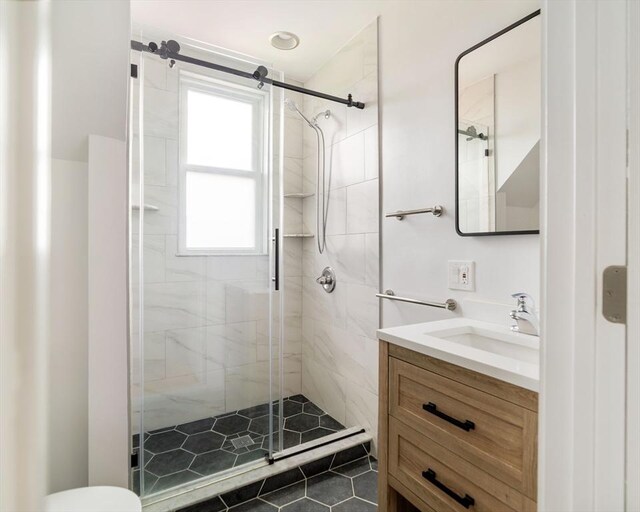 112 School Unit 3, Boston, MA 02119 - full bathroom with a shower stall, vanity, and toilet