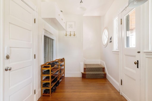 112 School Unit 3, Boston, MA 02119 - foyer with light wood-type flooring, baseboards, and stairway