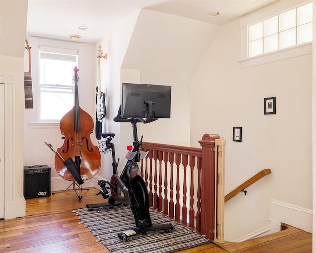 112 School Unit 3, Boston, MA 02119 - exercise area with healthy amount of natural light, wood finished floors, and baseboards
