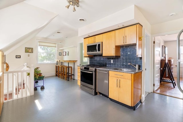 112 School Unit 3, Boston, MA 02119 - kitchen with appliances with stainless steel finishes, a sink, light brown cabinetry, backsplash, and baseboards