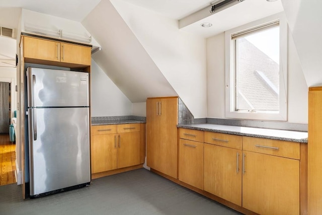 112 School Unit 3, Boston, MA 02119 - kitchen with freestanding refrigerator, light flooring, and vaulted ceiling