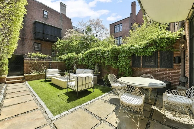 view of patio / terrace with an outdoor fire pit