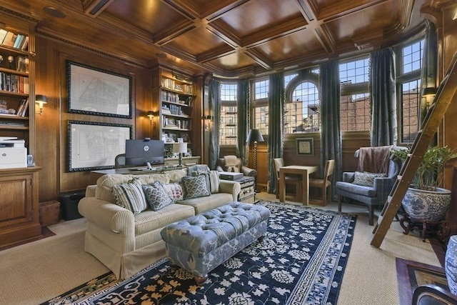 sitting room featuring built in shelves, wood walls, coffered ceiling, wood ceiling, and beamed ceiling