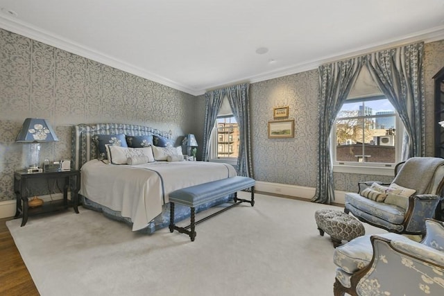 bedroom featuring baseboards, ornamental molding, and wallpapered walls