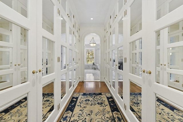 sunroom / solarium with arched walkways and french doors