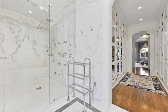 bathroom featuring recessed lighting, a marble finish shower, crown molding, and wood finished floors