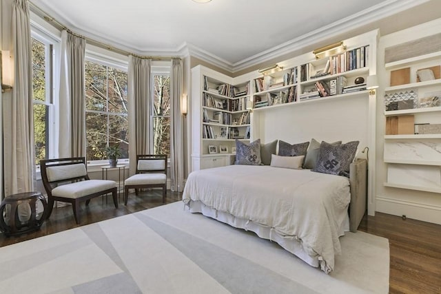 bedroom featuring multiple windows, dark wood finished floors, and crown molding