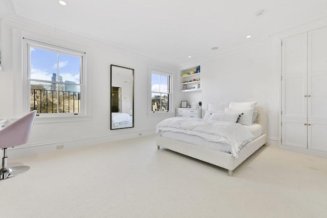 bedroom with multiple windows, recessed lighting, and light colored carpet