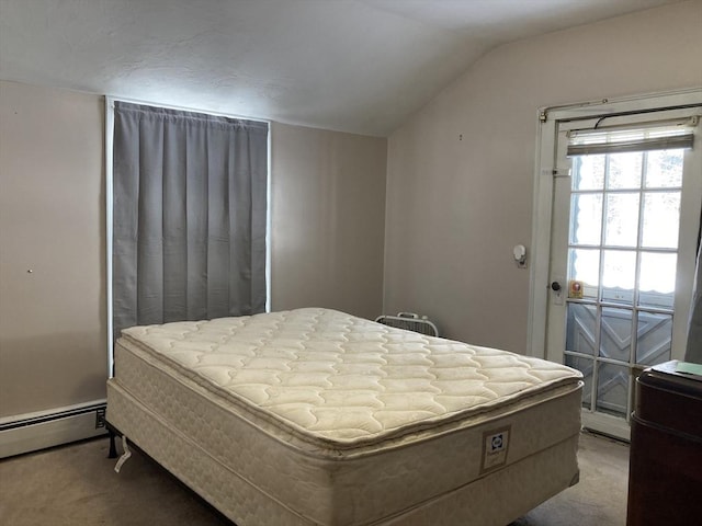 bedroom with a baseboard radiator, carpet, and lofted ceiling