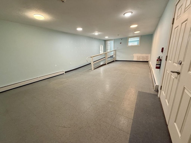 basement featuring a baseboard radiator