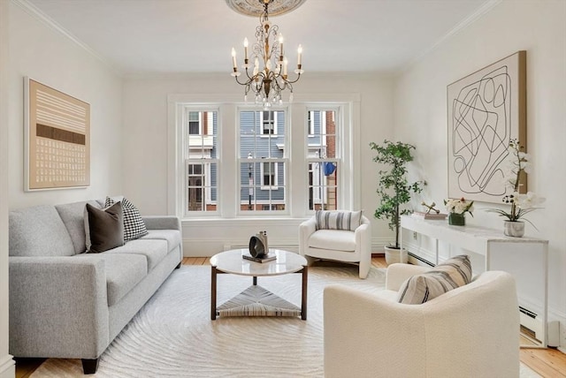 living room with baseboards, ornamental molding, and light wood-style floors