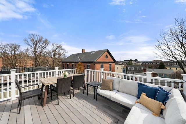 deck with outdoor dining area and outdoor lounge area