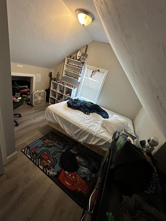 21 Sigel St, Worcester, MA 01610 - bedroom with wood finished floors and lofted ceiling