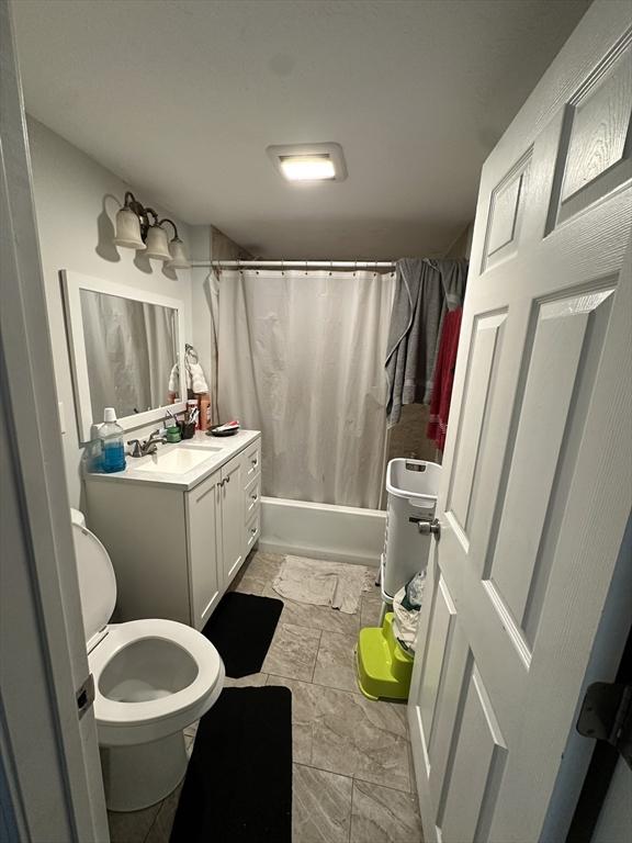 21 Sigel St, Worcester, MA 01610 - bathroom with vanity, toilet, and shower / bathtub combination with curtain