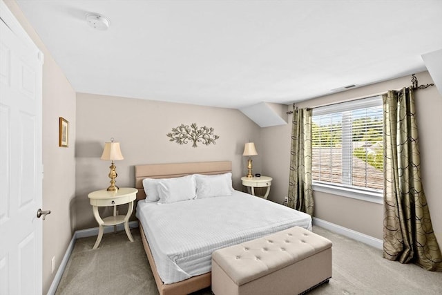 carpeted bedroom featuring baseboards