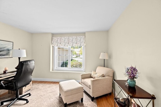 office space featuring wood finished floors and baseboards