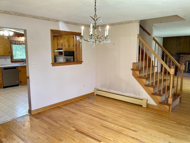 68 Briarbrook Dr, Seekonk, MA 02771 - unfurnished dining area with a baseboard heating unit, light wood finished floors, stairway, a sink, and a chandelier