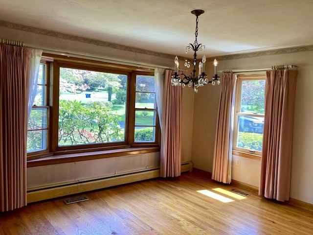68 Briarbrook Dr, Seekonk, MA 02771 - spare room with a chandelier, light wood-style floors, a baseboard heating unit, and baseboards