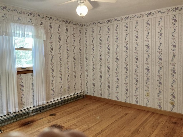 68 Briarbrook Dr, Seekonk, MA 02771 - empty room with wood finished floors, baseboards, a baseboard heating unit, and a ceiling fan