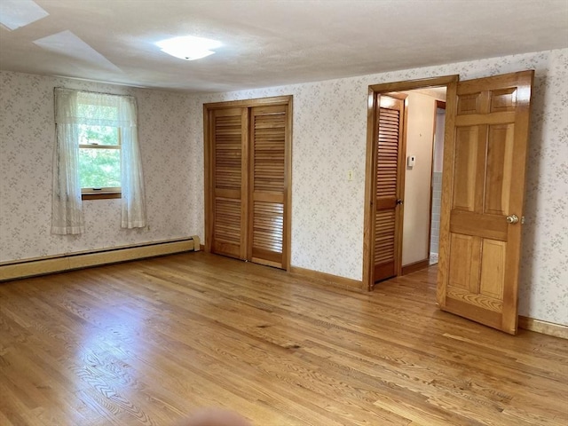 68 Briarbrook Dr, Seekonk, MA 02771 - unfurnished bedroom featuring light wood-type flooring, wallpapered walls, and a closet