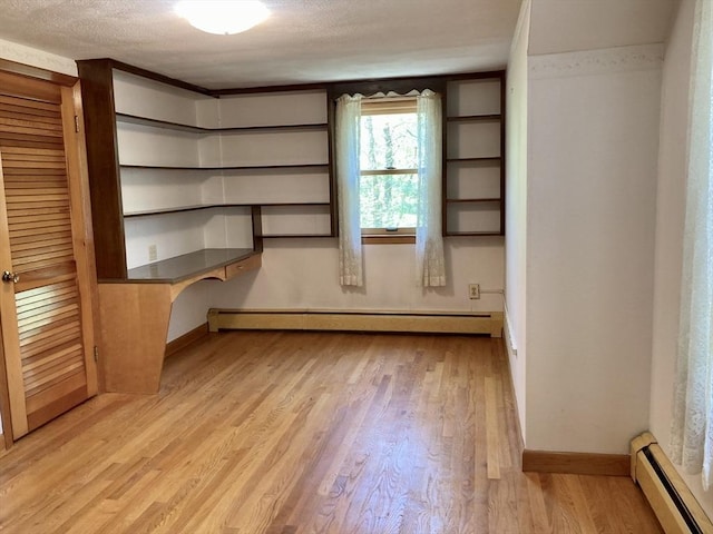 68 Briarbrook Dr, Seekonk, MA 02771 - unfurnished office featuring a baseboard radiator, a baseboard heating unit, baseboards, light wood finished floors, and a textured ceiling