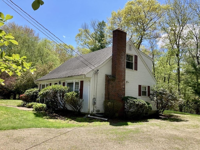 68 Briarbrook Dr, Seekonk, MA 02771 - view of side of home featuring a yard, a chimney, and a shingled roof