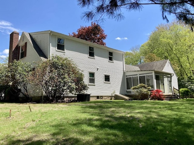 68 Briarbrook Dr, Seekonk, MA 02771 - rear view of property featuring a sunroom, a chimney, central AC, and a yard