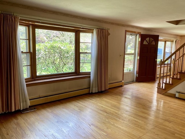 68 Briarbrook Dr, Seekonk, MA 02771 - foyer entrance with a baseboard radiator, stairs, and light wood-style floors