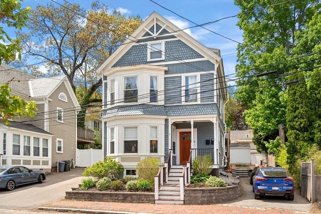 4 Arlington St Unit A, Newburyport, MA 01950 - victorian home with a balcony and fence