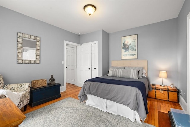 4 Arlington St Unit A, Newburyport, MA 01950 - bedroom featuring wood finished floors, a closet, and baseboards