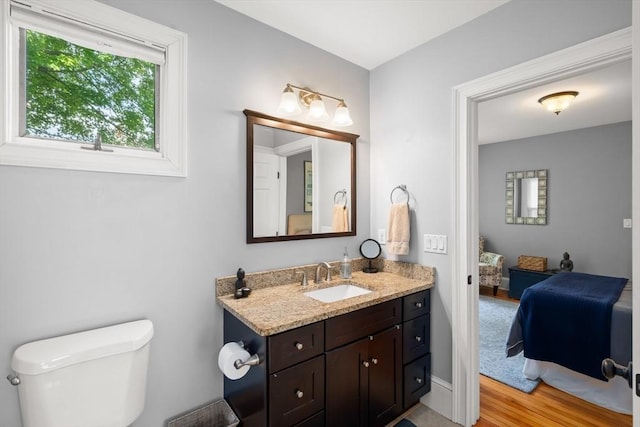 4 Arlington St Unit A, Newburyport, MA 01950 - bathroom featuring toilet, vanity, and wood finished floors